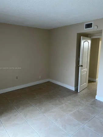 an empty room with a bathroom