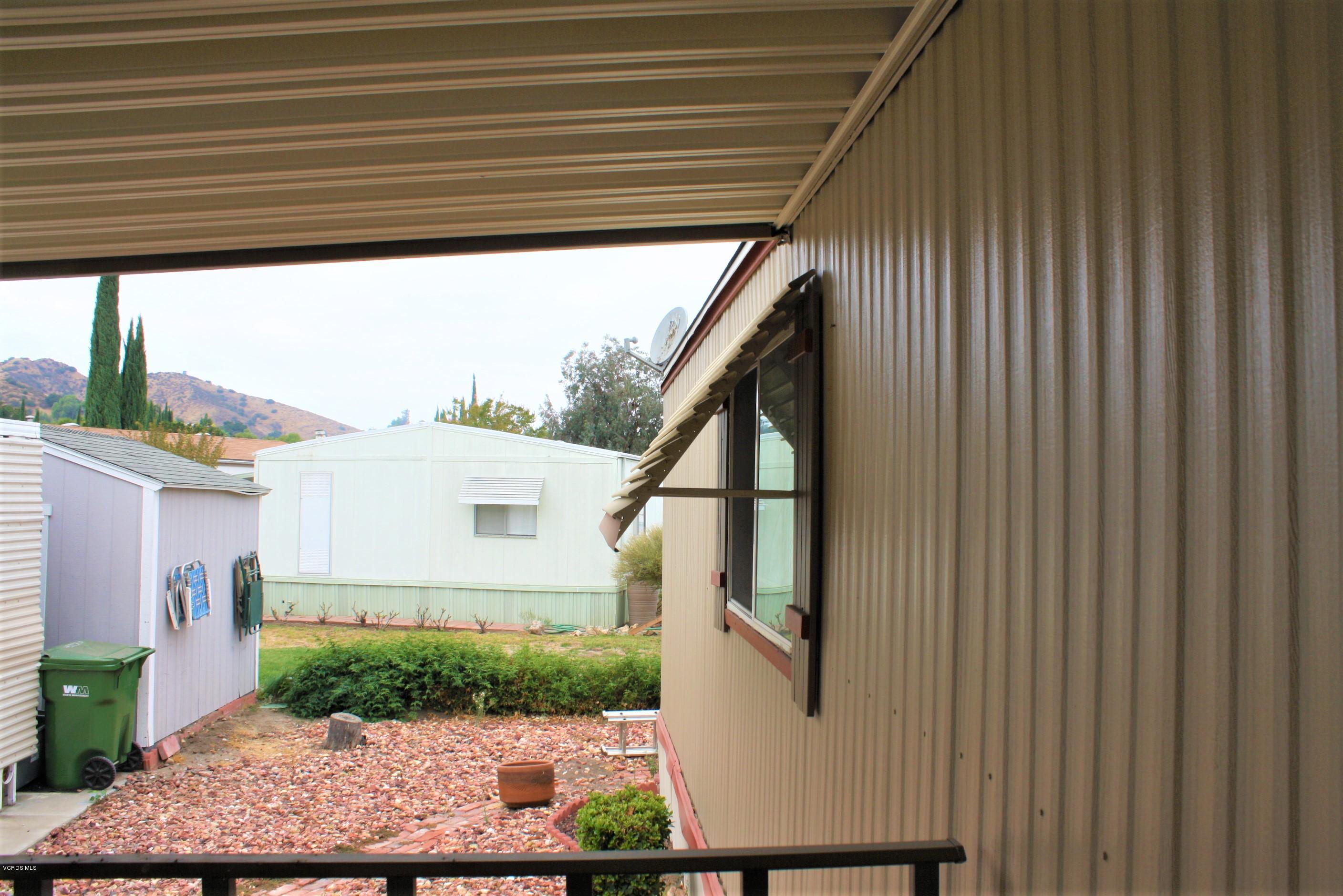 6480 Katherine Road, Unit 107 Simi Valley, CA 93063 - Photo 7 of 22 a view of a house with a street