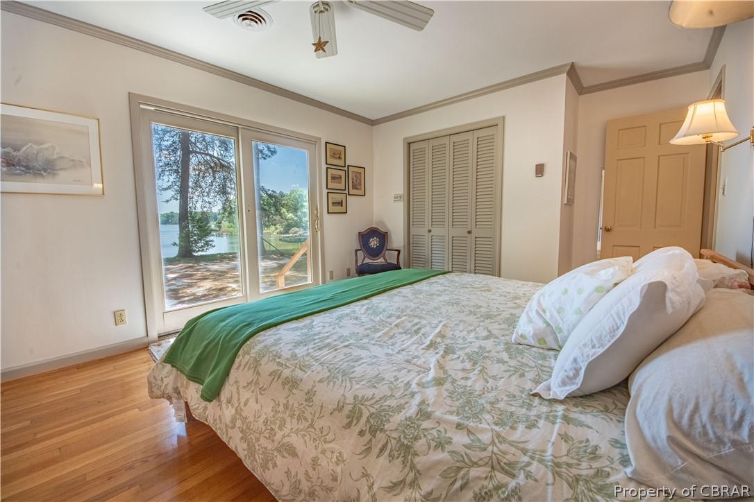 242 White Point Road Kinsale, VA 22488 - Photo 24 of 43 Primary bedroom has wonderful water views and sliders to backyard.
