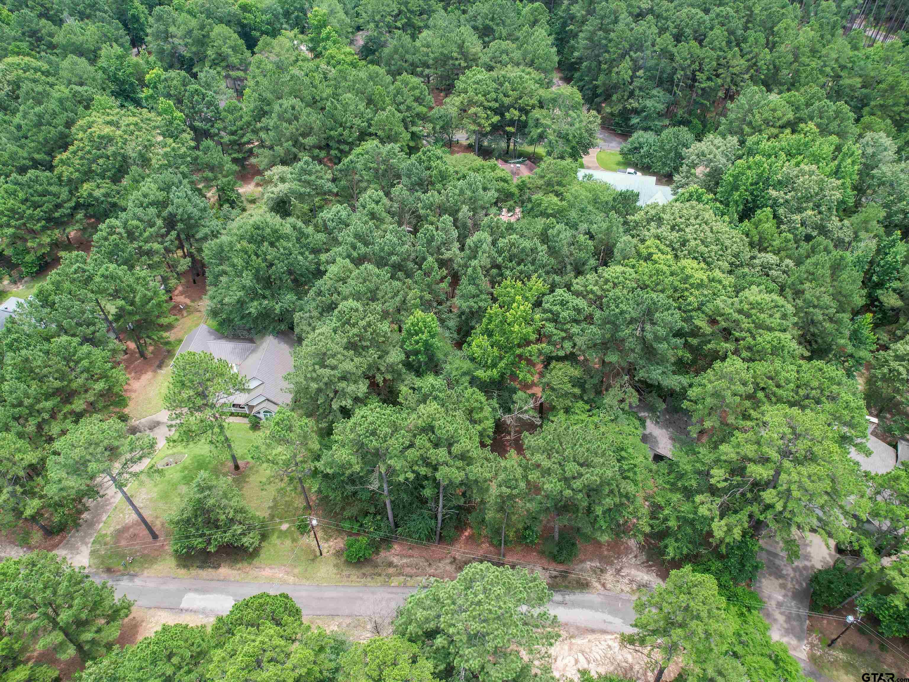 208 Pack Saddle Holly Lake Ranch, TX 75765 - Photo 4 of 11 an aerial view of residential house with outdoor space and trees all around