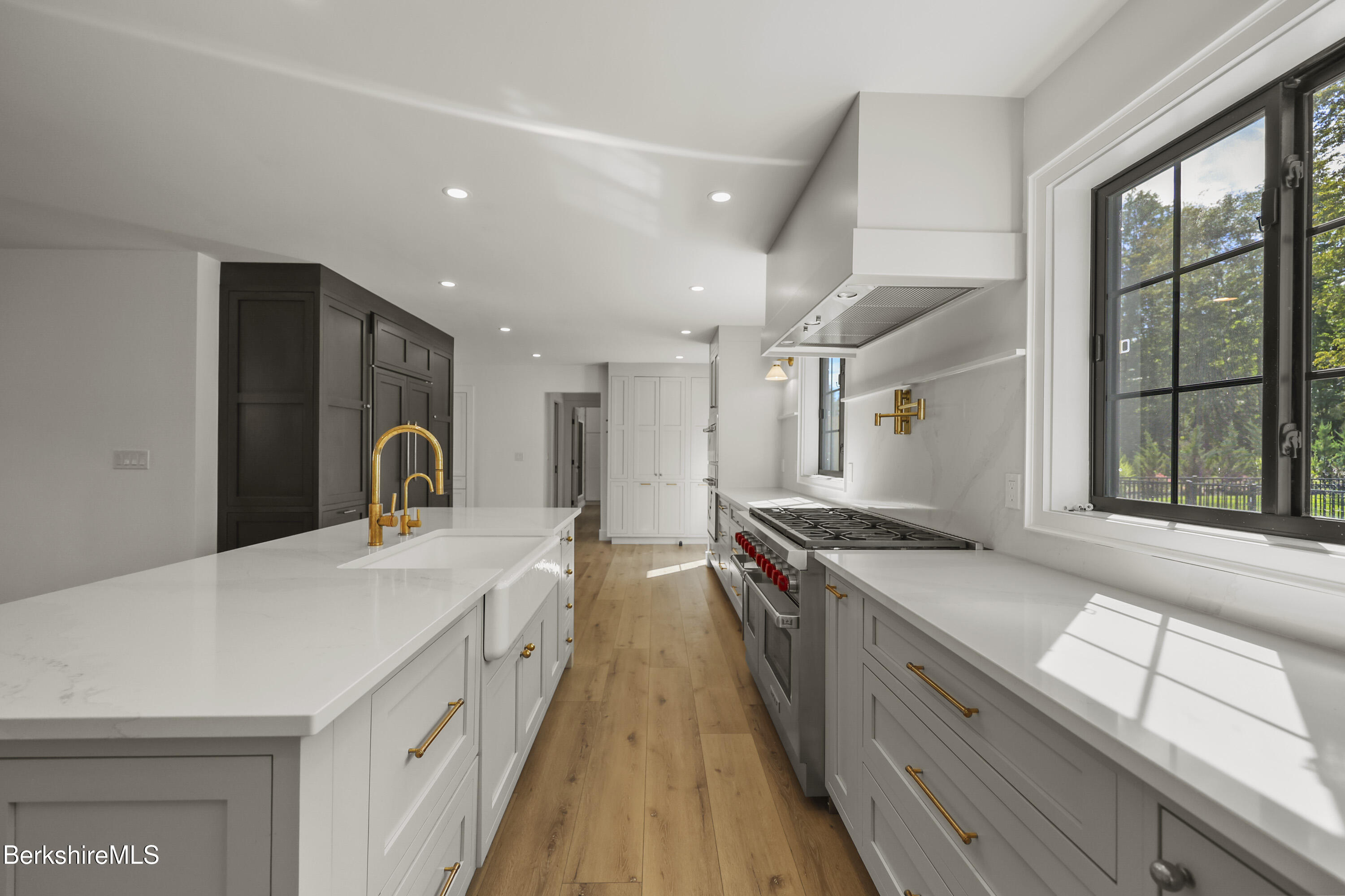 65 Johnson Road Dalton, MA 01226 - Photo 15 of 76 a open kitchen with stainless steel appliances granite countertop a stove and a large window