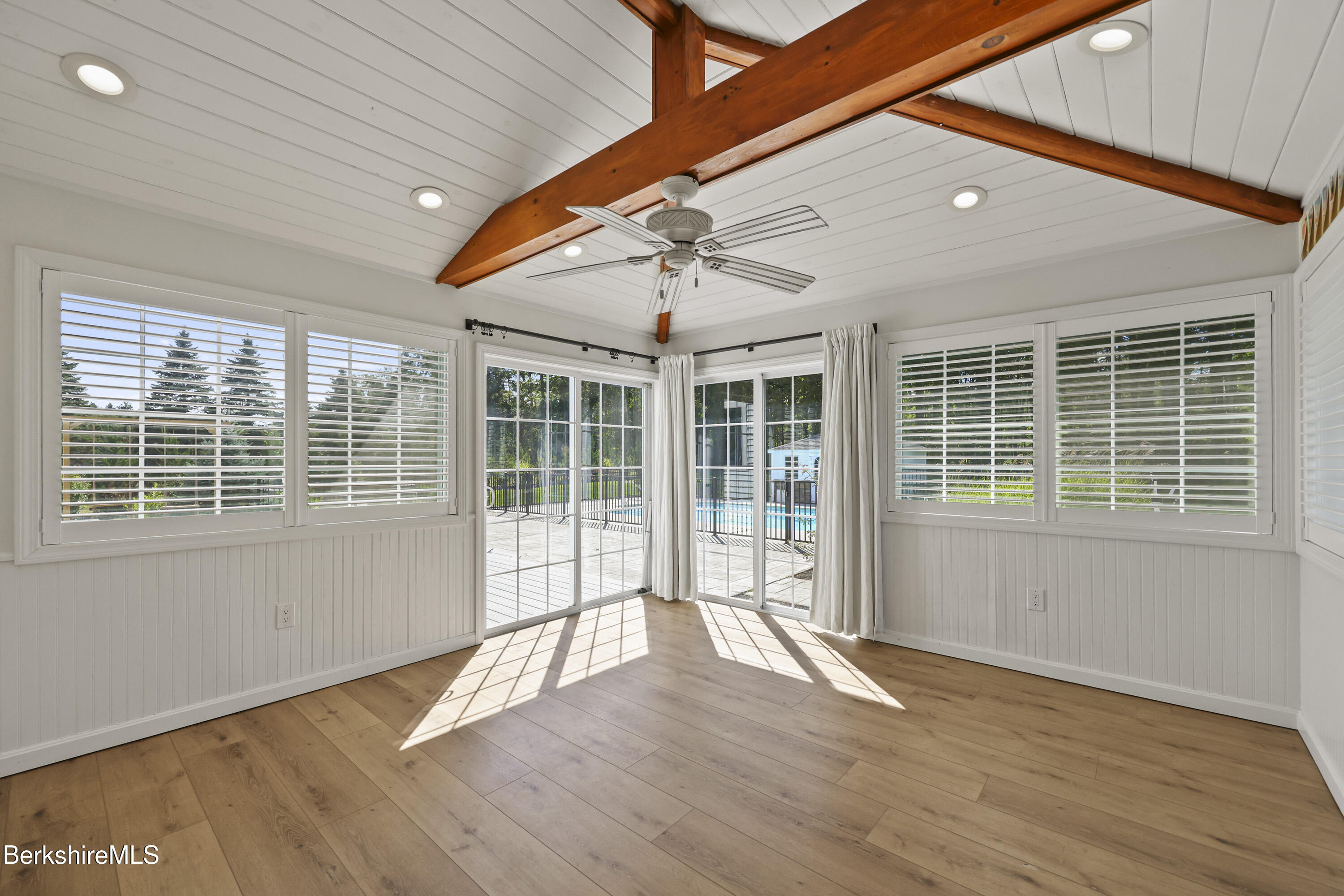 65 Johnson Road Dalton, MA 01226 - Photo 22 of 76 a view of empty room with wooden floor and fan