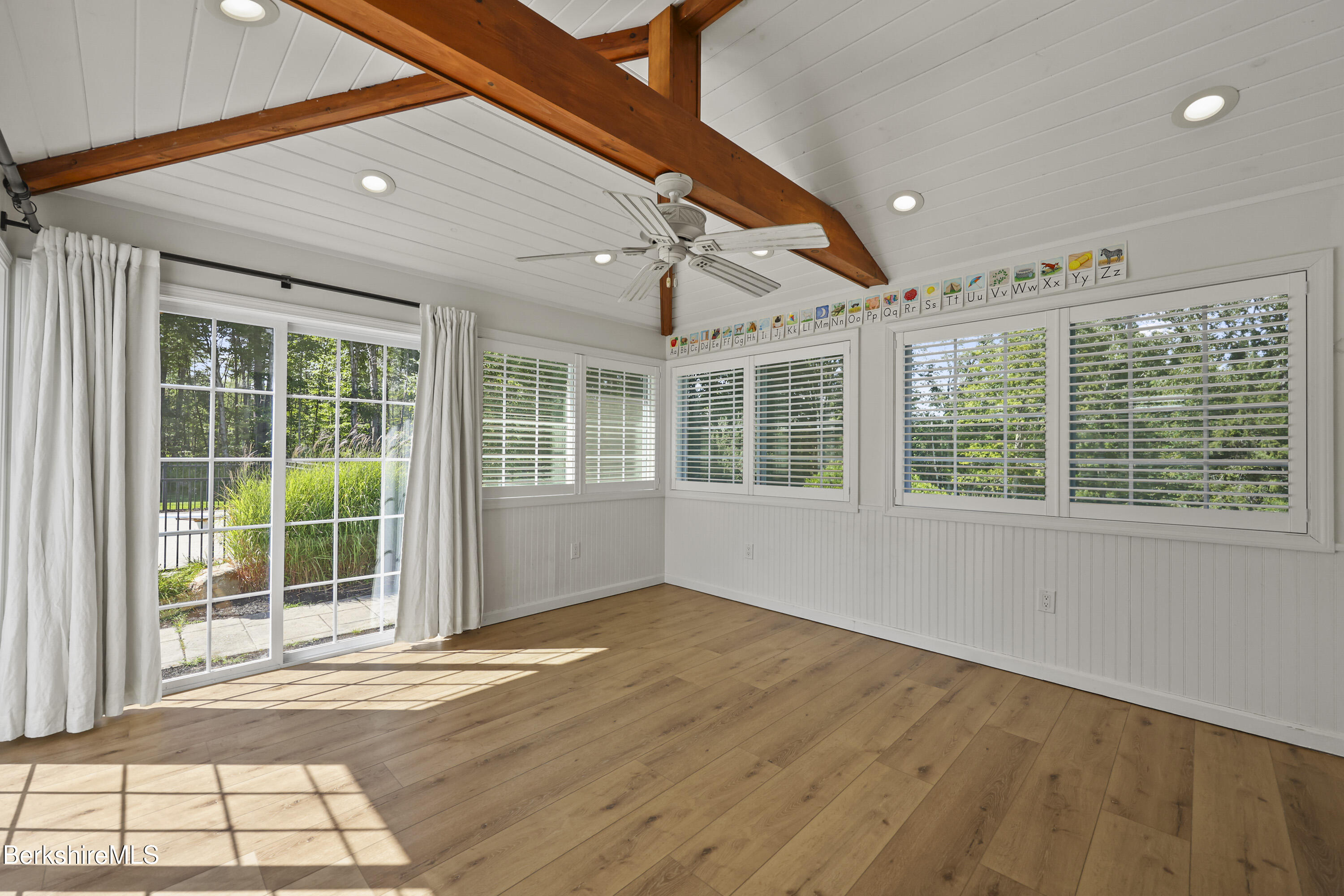 65 Johnson Road Dalton, MA 01226 - Photo 24 of 76 a view of an empty room with wooden floor and a window
