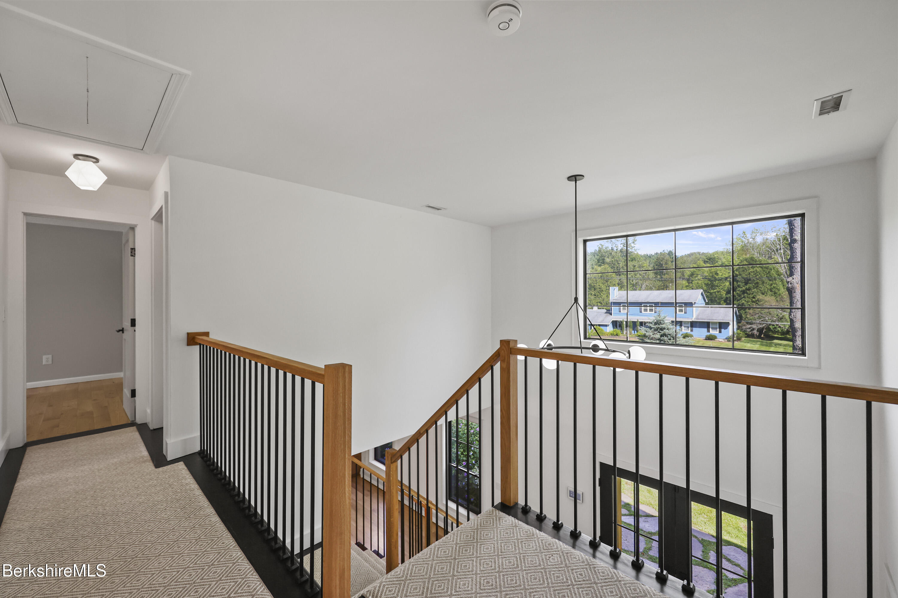 65 Johnson Road Dalton, MA 01226 - Photo 30 of 76 a view of a hallway with window and stairs