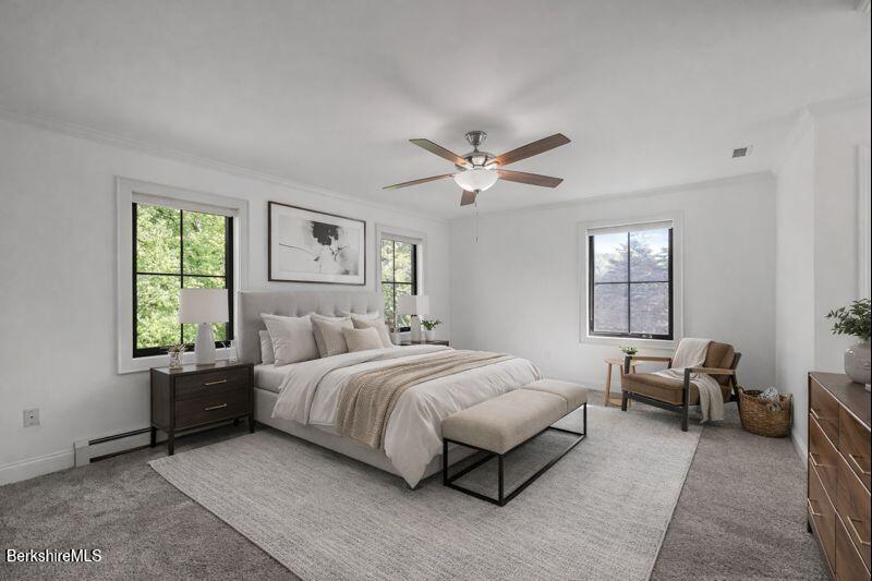 65 Johnson Road Dalton, MA 01226 - Photo 32 of 76 a bedroom with a bed a chandelier and a window