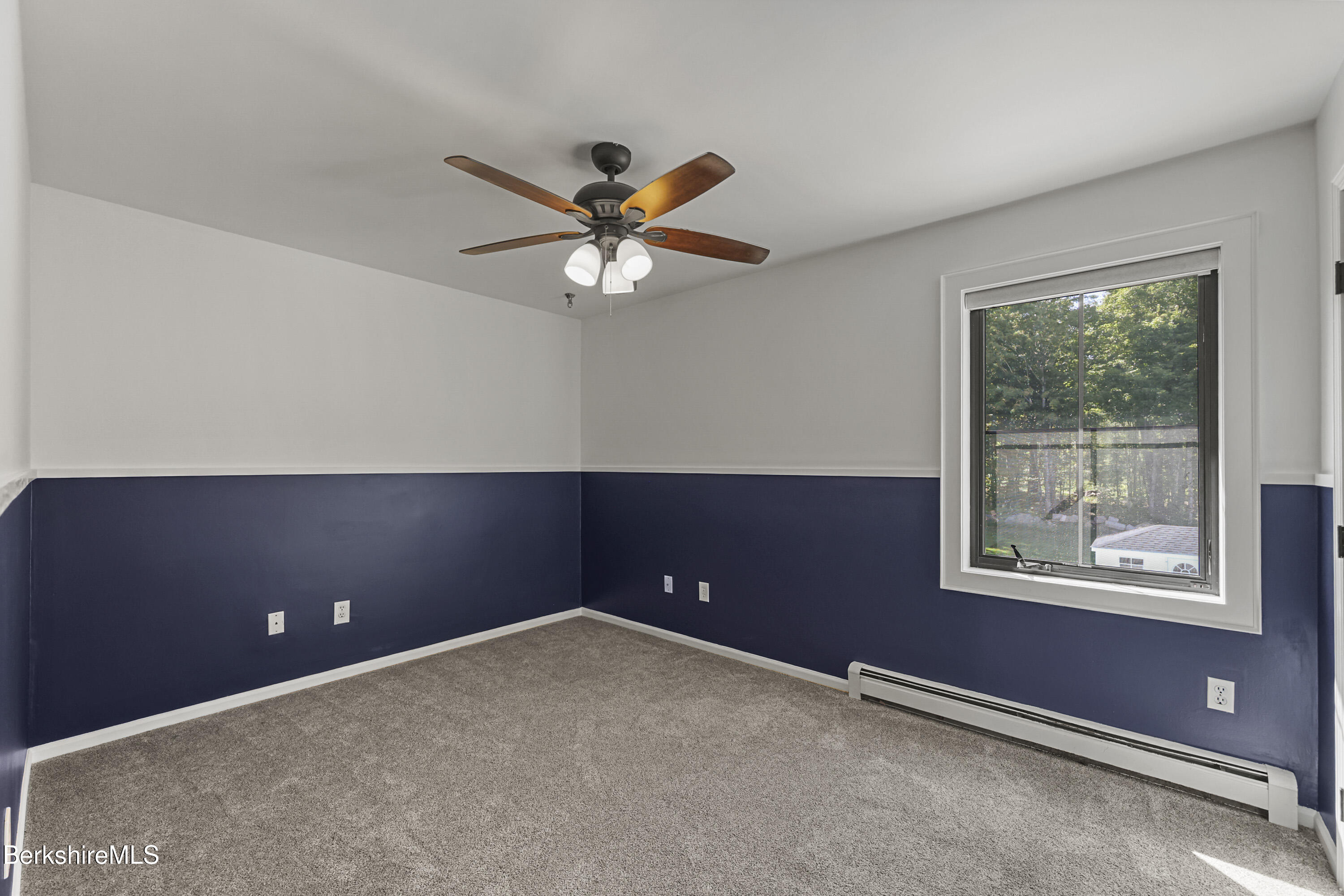 65 Johnson Road Dalton, MA 01226 - Photo 39 of 76 an empty room with windows and fan