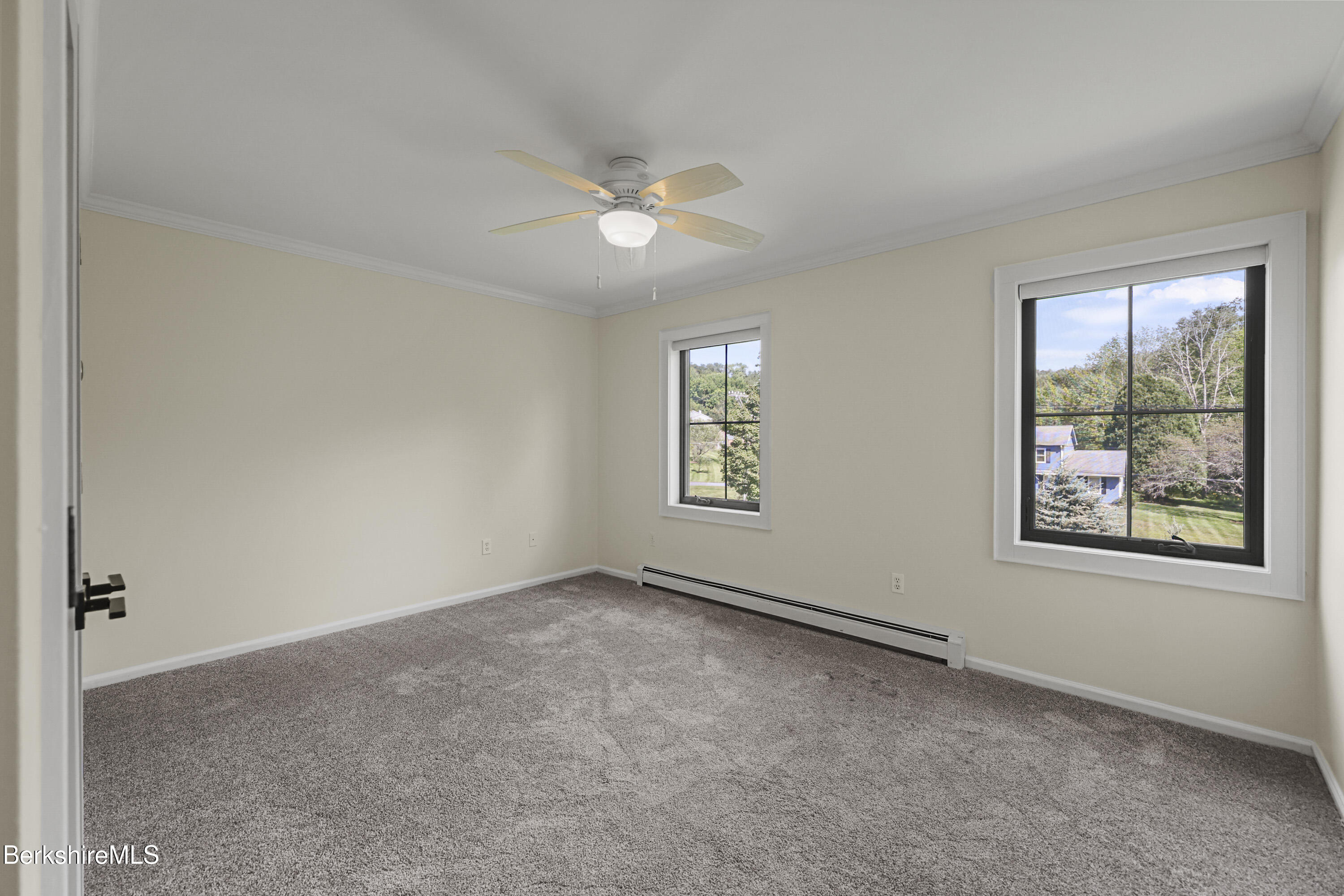 65 Johnson Road Dalton, MA 01226 - Photo 42 of 76 an empty room with windows and ceiling fan