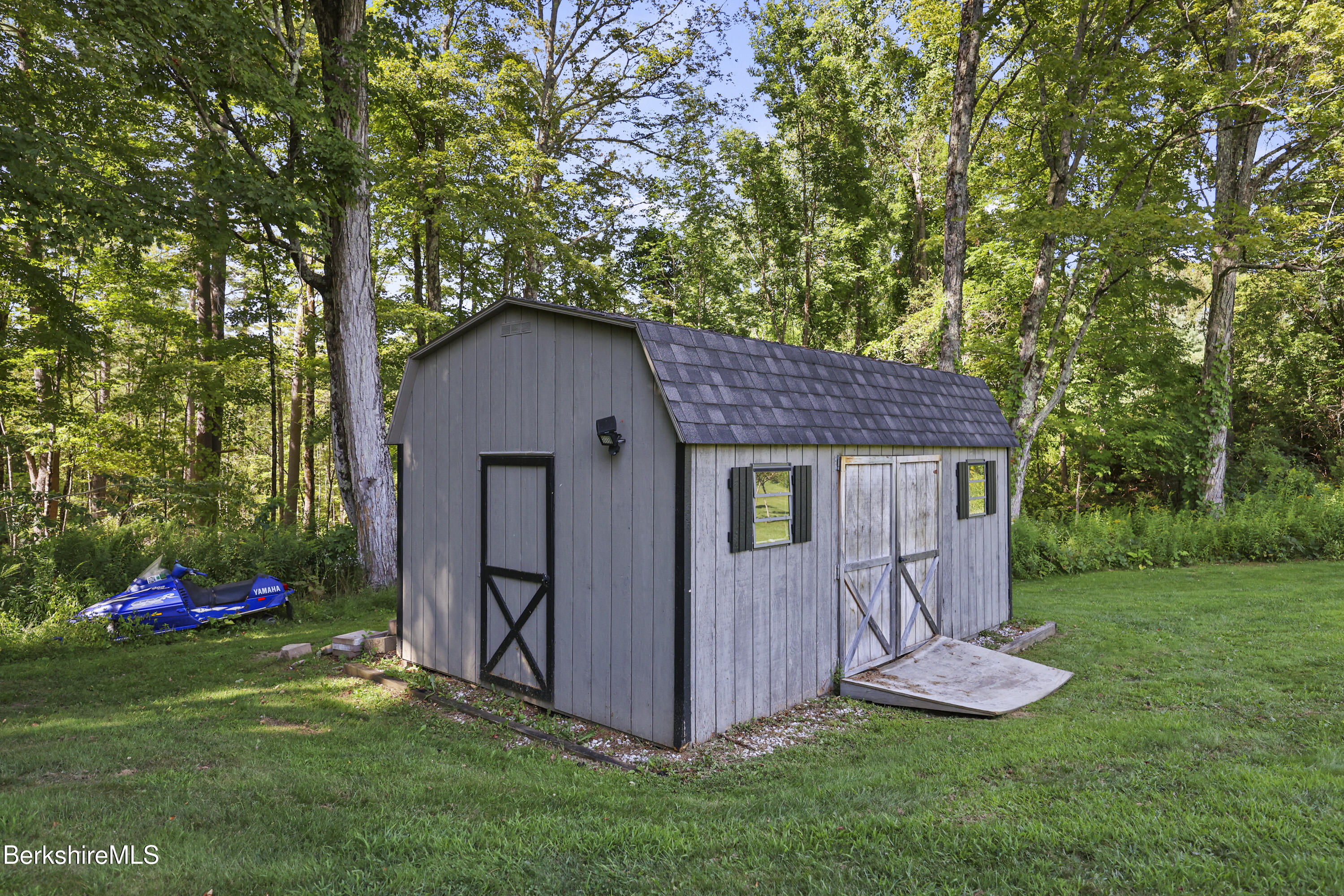 65 Johnson Road Dalton, MA 01226 - Photo 69 of 76 a view of backyard with a barn and a large tree
