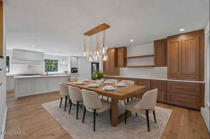 65 Johnson Road Dalton, MA 01226 - Photo 9 of 76 a kitchen with a table chairs sink and cabinets
