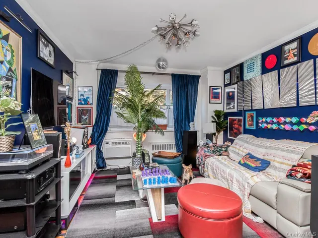 a very nice looking room with many windows and furniture