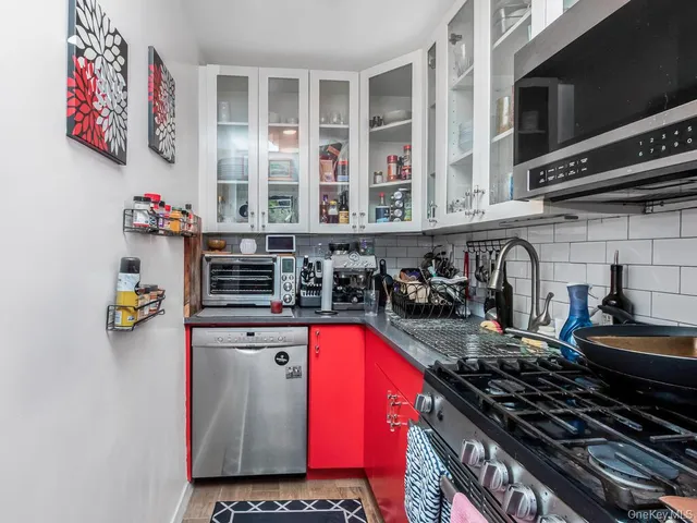 a kitchen with a stove and a sink