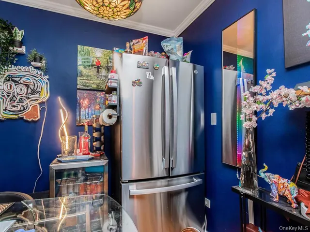 a dining room with furniture chandelier and fire place
