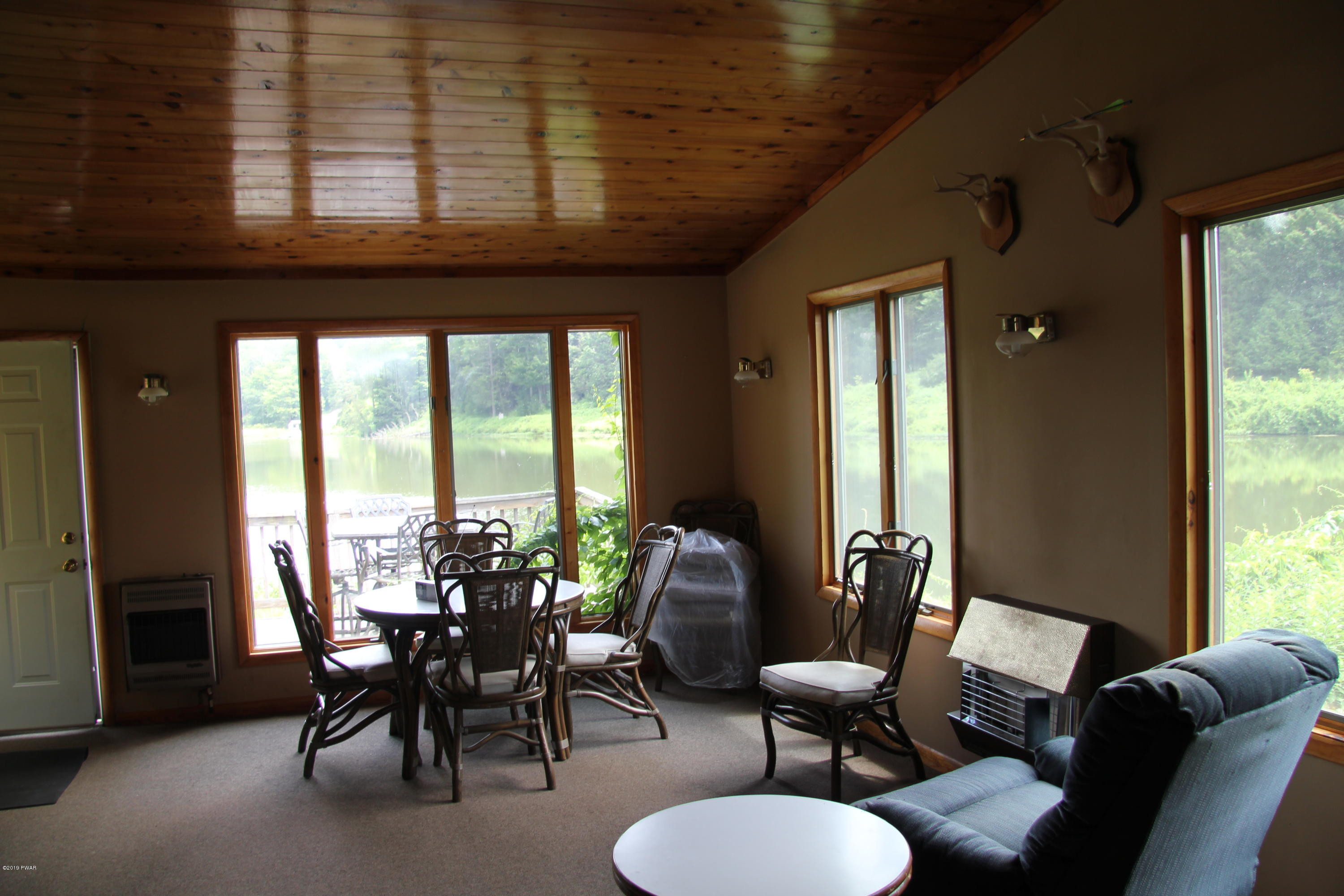 419 Bare Valley Road Montrose, PA 18801 - Photo 55 of 72 a view of a livingroom with furniture and a large window