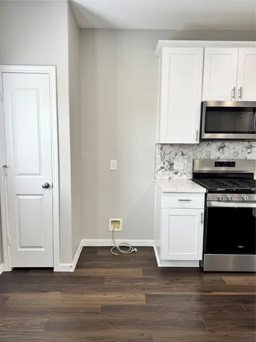 a kitchen with a stove and a sink