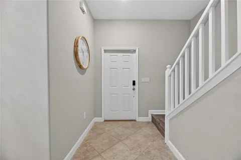 a kitchen with stainless steel appliances granite countertop a stove top oven a sink refrigerator and cabinets