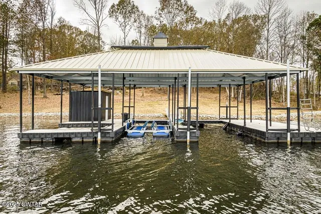 an outdoor space with swimming pool and furniture