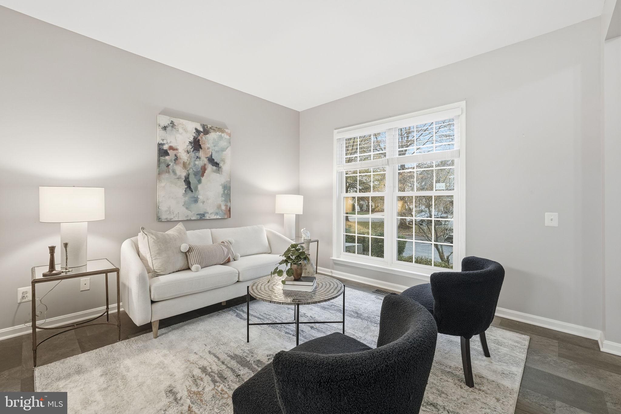 12402 Brown Fox Way Reston, VA 20191 - Photo 14 of 52 a living room with furniture and a large window