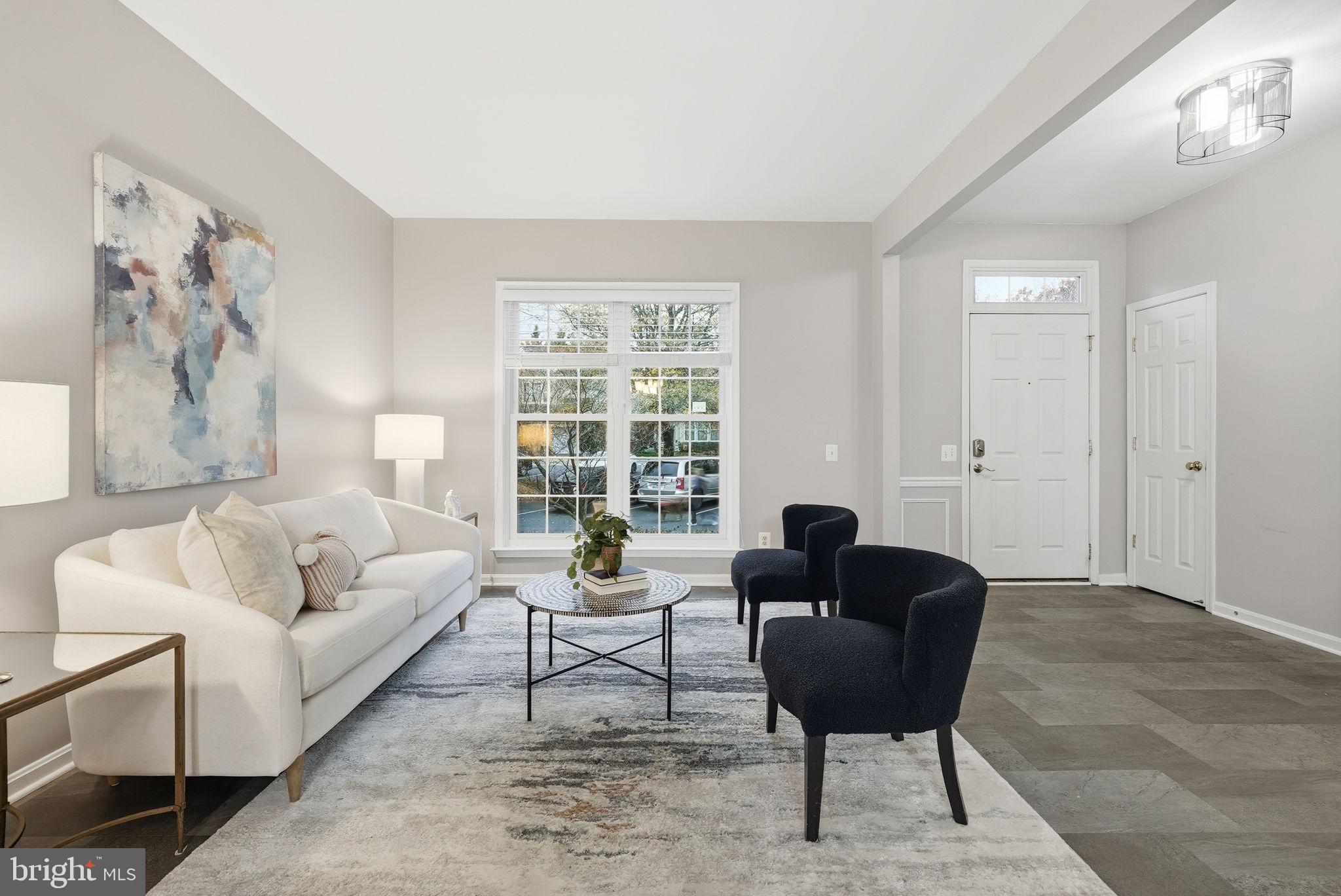 12402 Brown Fox Way Reston, VA 20191 - Photo 20 of 52 a living room with furniture and a large window
