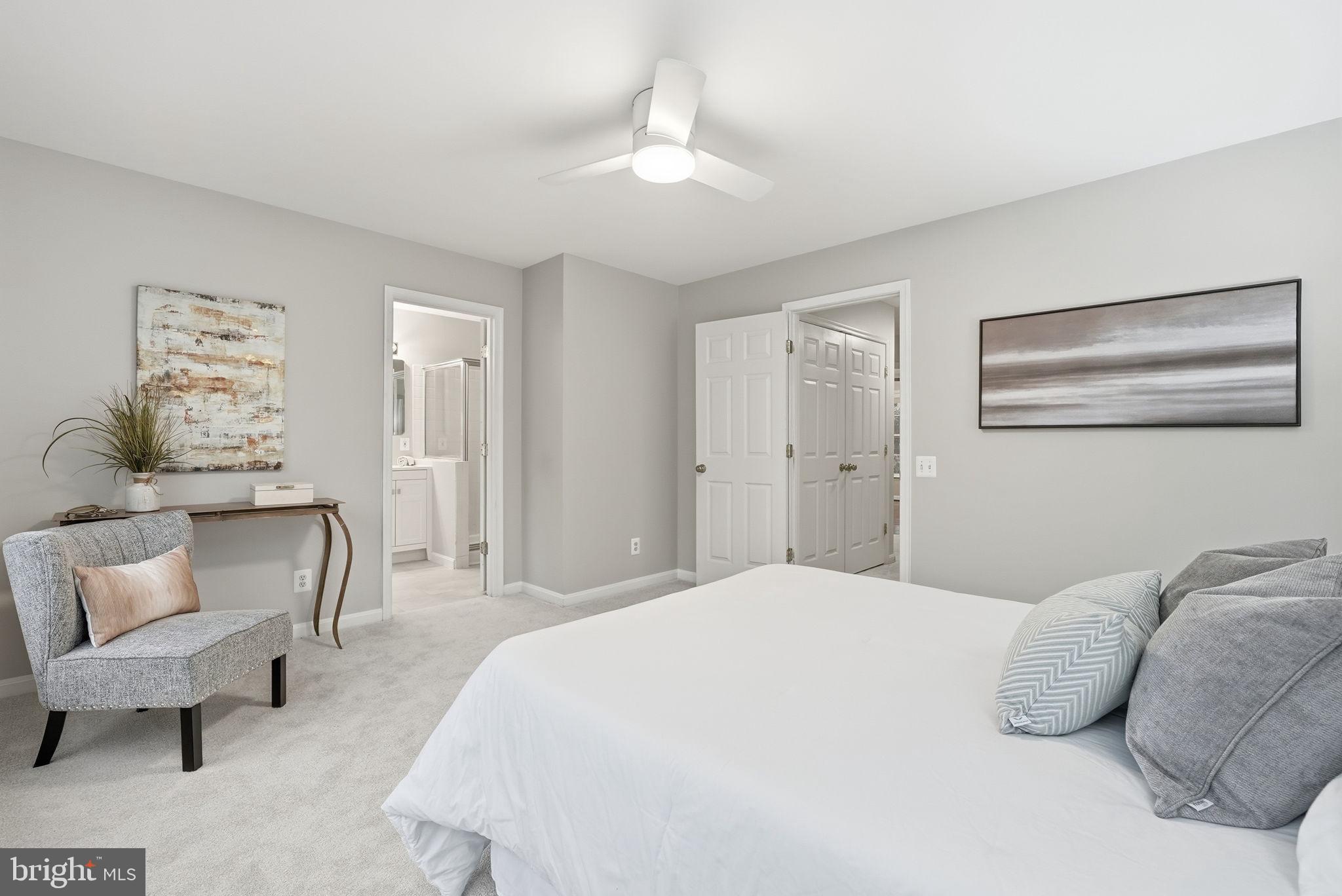 12402 Brown Fox Way Reston, VA 20191 - Photo 26 of 52 a bedroom with a bed and a couch