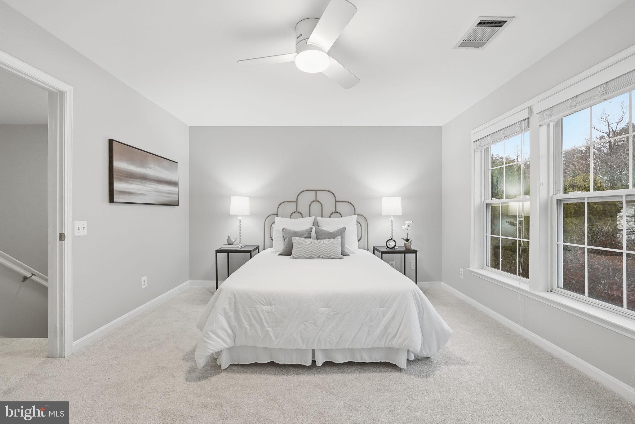 12402 Brown Fox Way Reston, VA 20191 - Photo 27 of 52 a large white bed in a white room