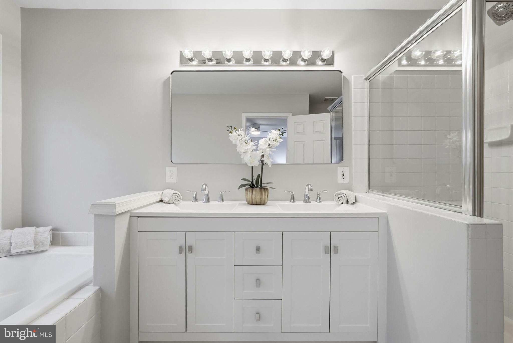 12402 Brown Fox Way Reston, VA 20191 - Photo 29 of 52 a bathroom with a sink and a mirror