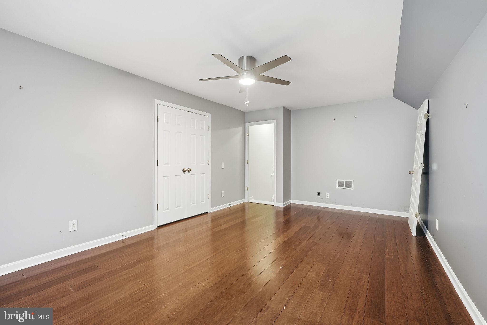 12402 Brown Fox Way Reston, VA 20191 - Photo 33 of 52 a view of an empty room with wooden floor