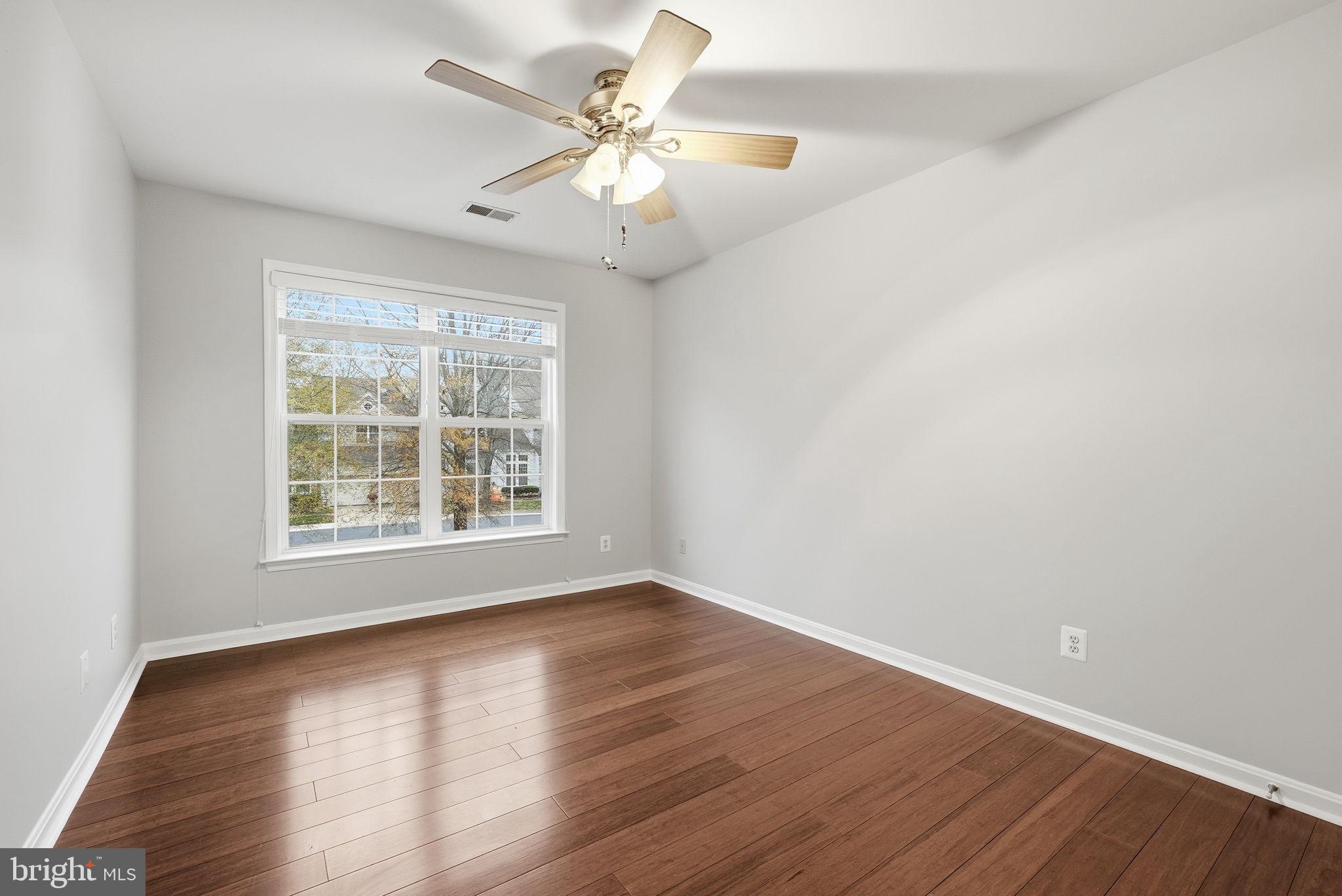 12402 Brown Fox Way Reston, VA 20191 - Photo 34 of 52 a view of an empty room with wooden floor and a window