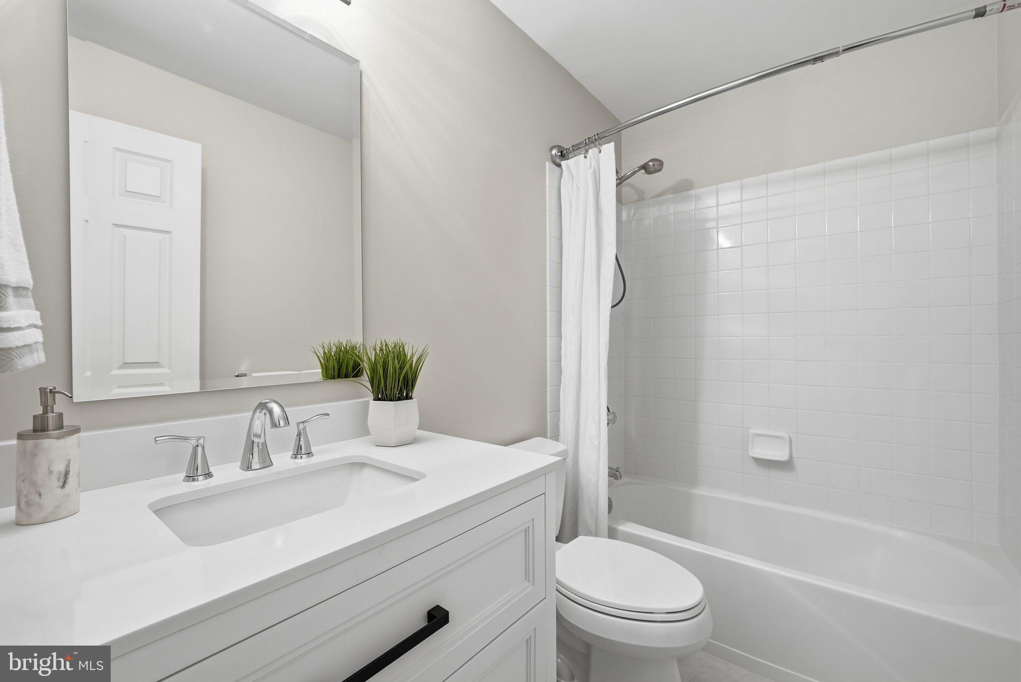 12402 Brown Fox Way Reston, VA 20191 - Photo 36 of 52 a bathroom with a sink toilet and shower