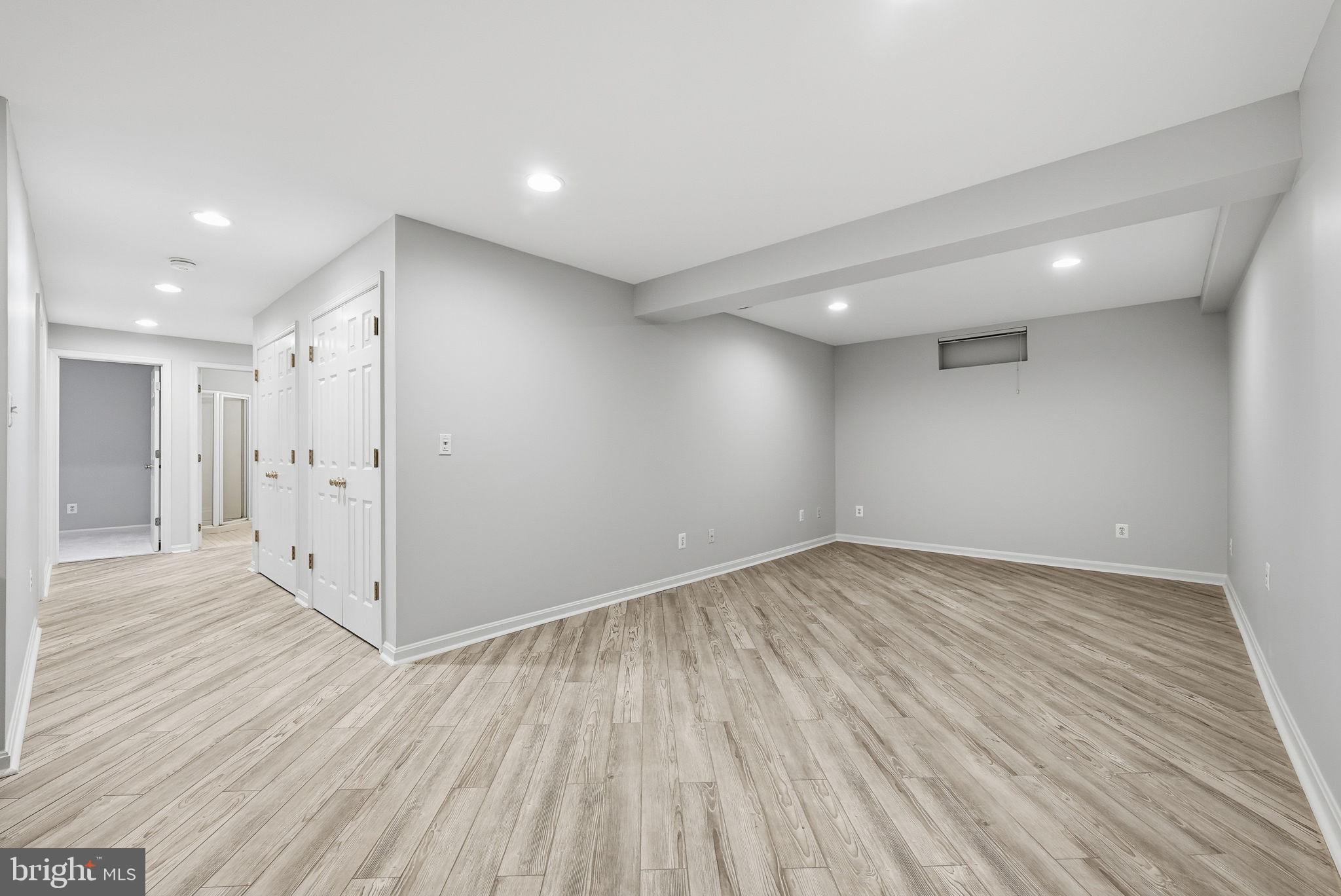 12402 Brown Fox Way Reston, VA 20191 - Photo 43 of 52 a view of an empty room with wooden floor
