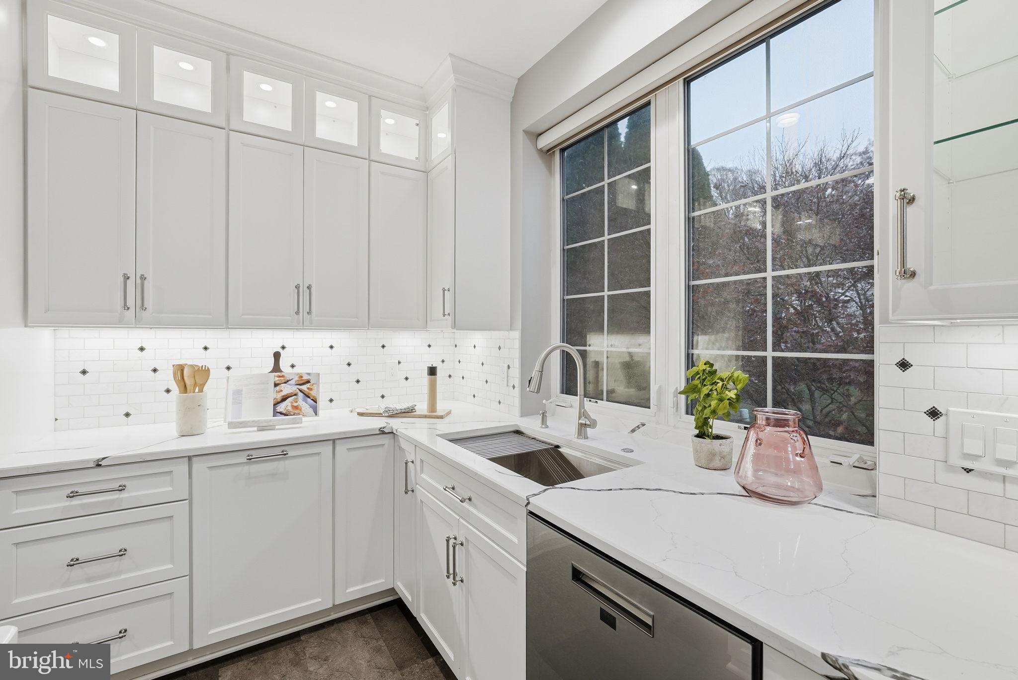 12402 Brown Fox Way Reston, VA 20191 - Photo 7 of 52 a kitchen with a sink and cabinets