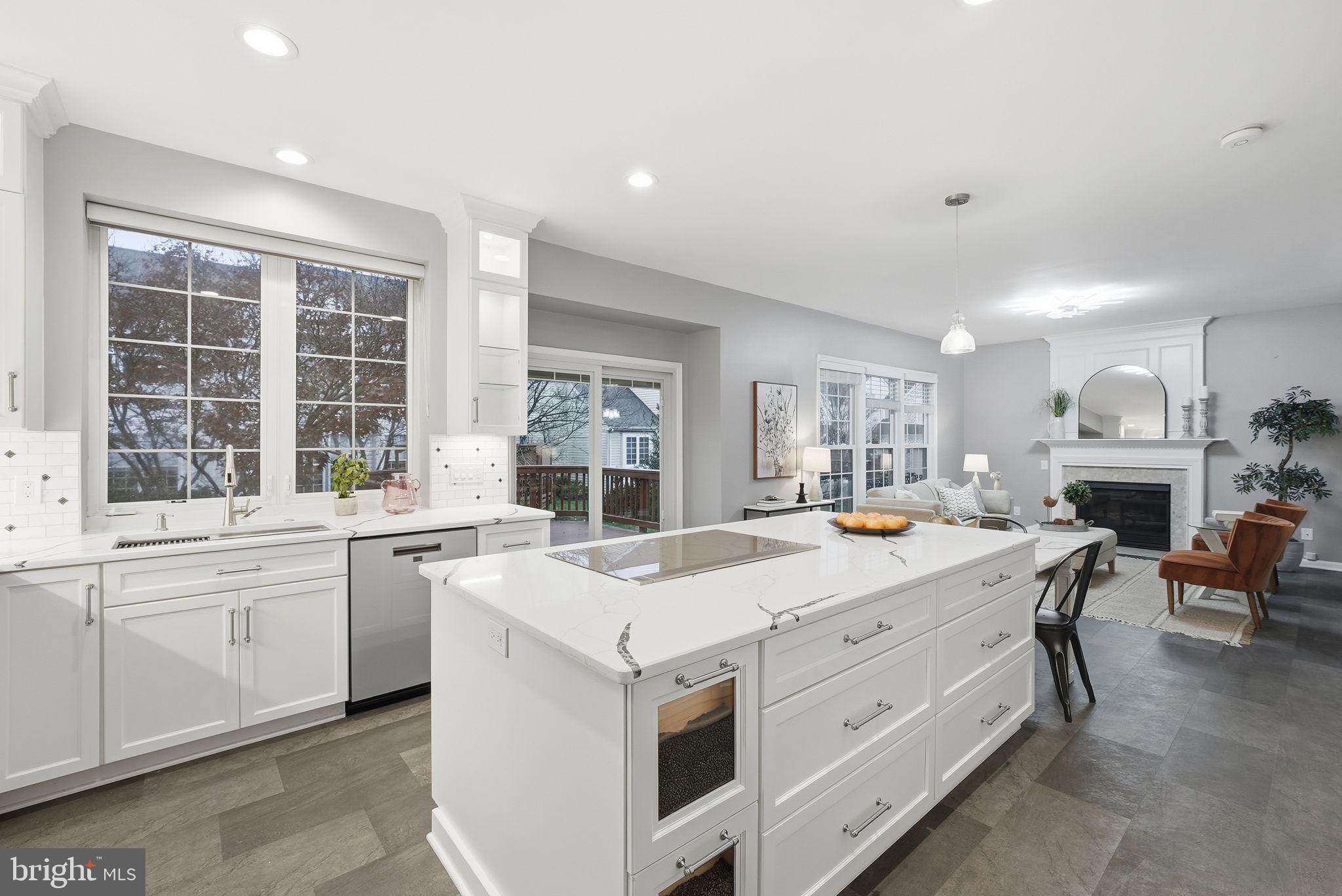 12402 Brown Fox Way Reston, VA 20191 - Photo 9 of 52 a large white kitchen with a stove top oven and a large window
