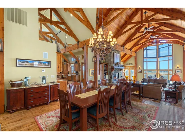 a view of a dining room with furniture and chandelier