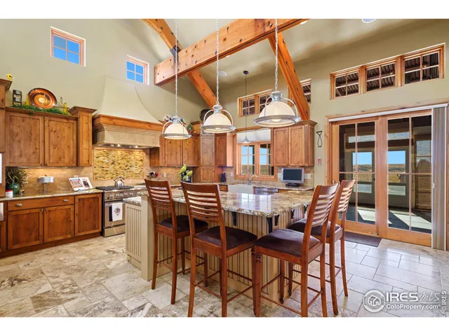 a dinning table and chairs in the kitchen