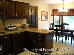 6823 Uppingham Road Fayetteville, NC 28306 - Photo 10 of 18 a kitchen with sink and cabinets