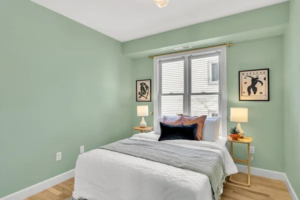 a bedroom with a bed and window