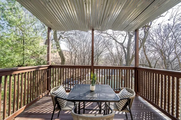 a view of a two chairs and table in the balcony