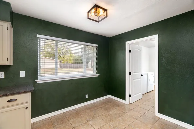 a view of an entryway with wooden floor and window