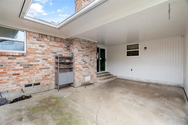 a view of empty room with windows