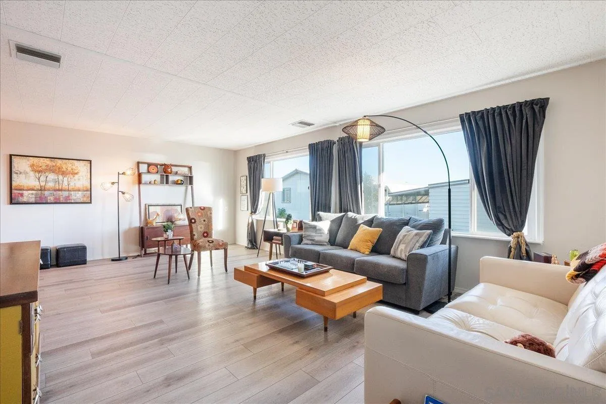 90 Blue Sky Lane Oceanside, CA 92056 - Photo 5 of 26 a living room with furniture and a flat screen tv