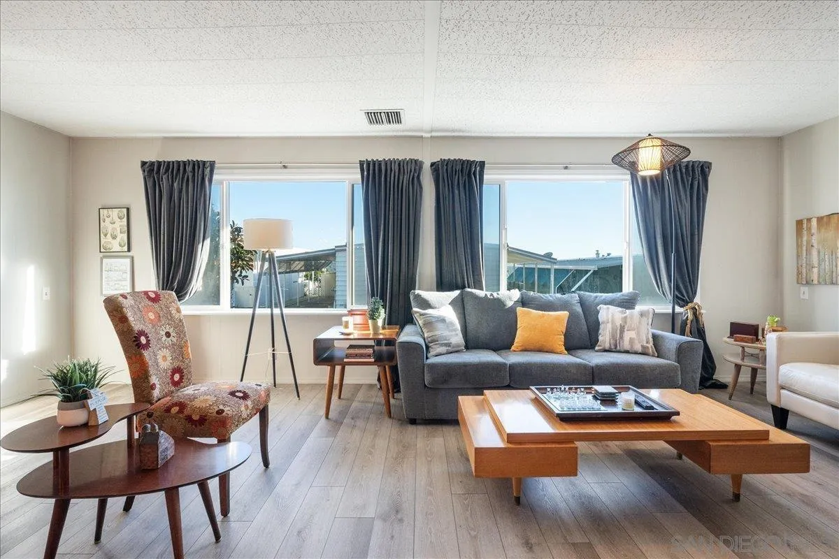 90 Blue Sky Lane Oceanside, CA 92056 - Photo 6 of 26 a living room with furniture and a large window