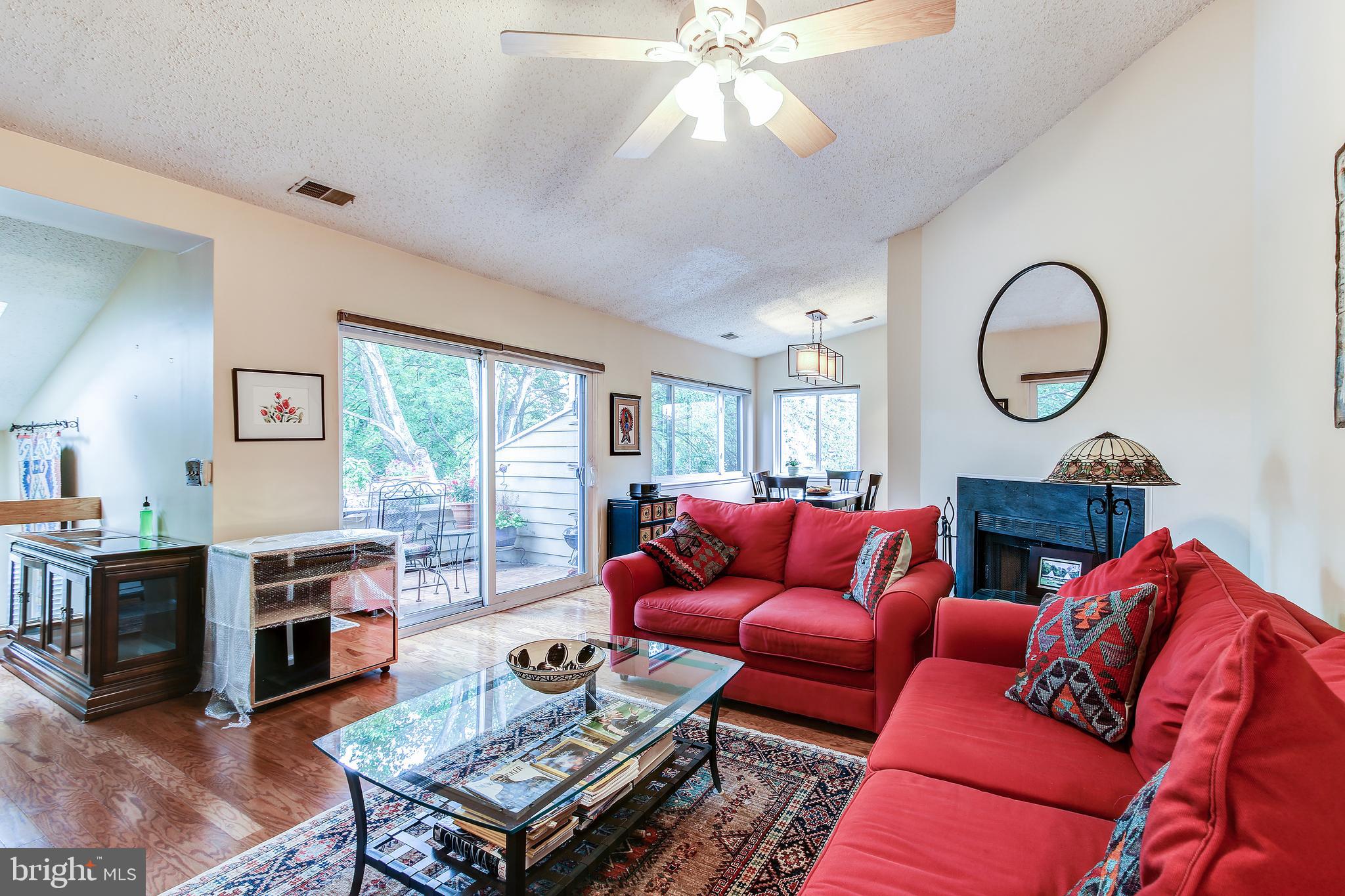 11049 Villaridge Court Reston, VA 20191 - Photo 4 of 29 Living room with wood burning fireplace