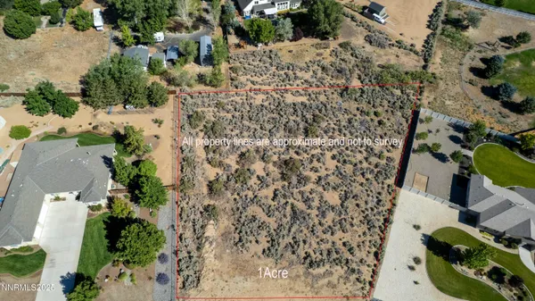 an aerial view of residential house with parking