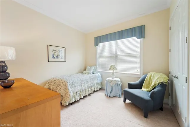 a bedroom with two beds and a couch