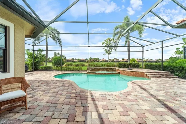 a view of a swimming pool with a patio