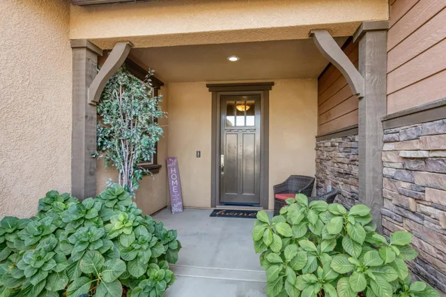 a front view of a house with garden