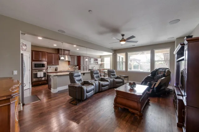 a living room with furniture window and wooden floor
