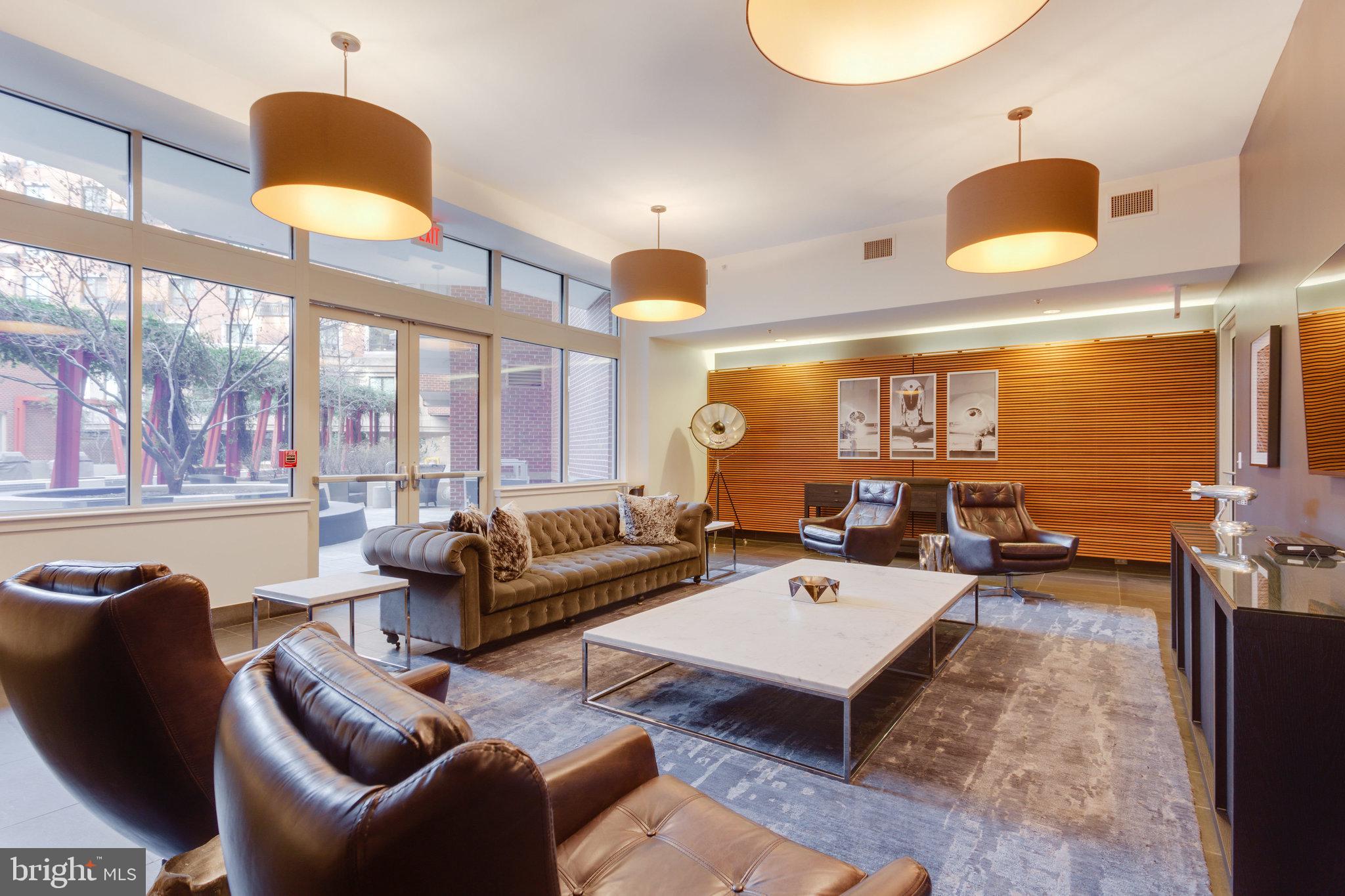 1000 New Jersey Avenue Southeast, Unit 515 Washington, DC 20003 - Photo 12 of 19 a living room with furniture and a large window