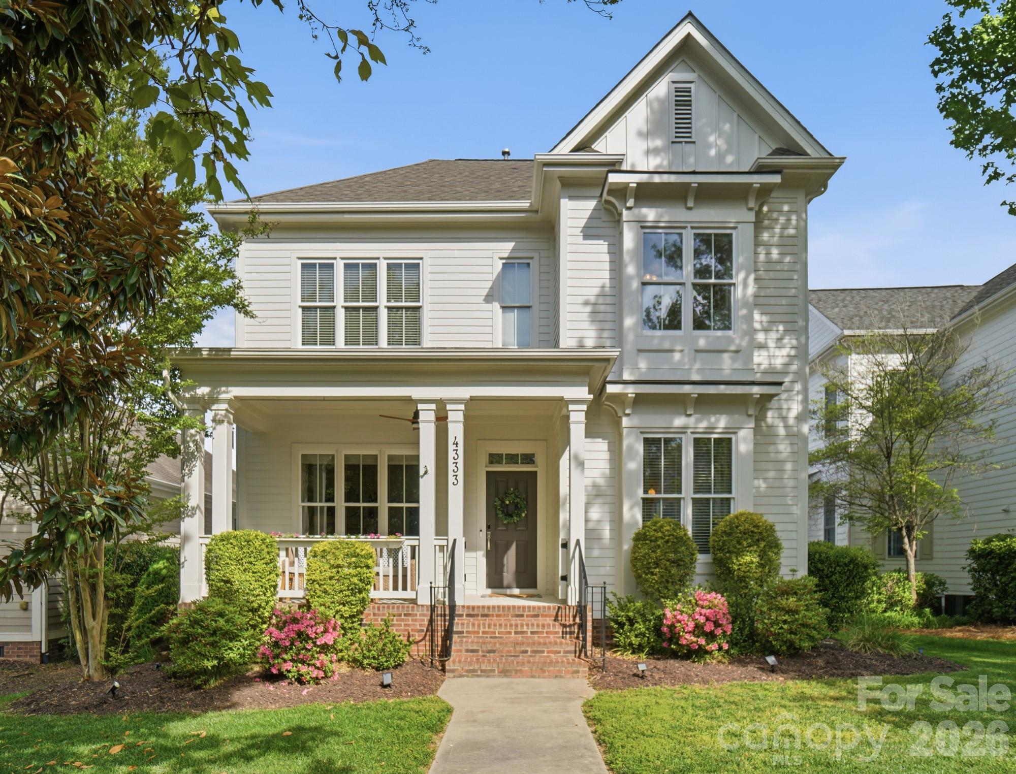 front view of a house with a yard