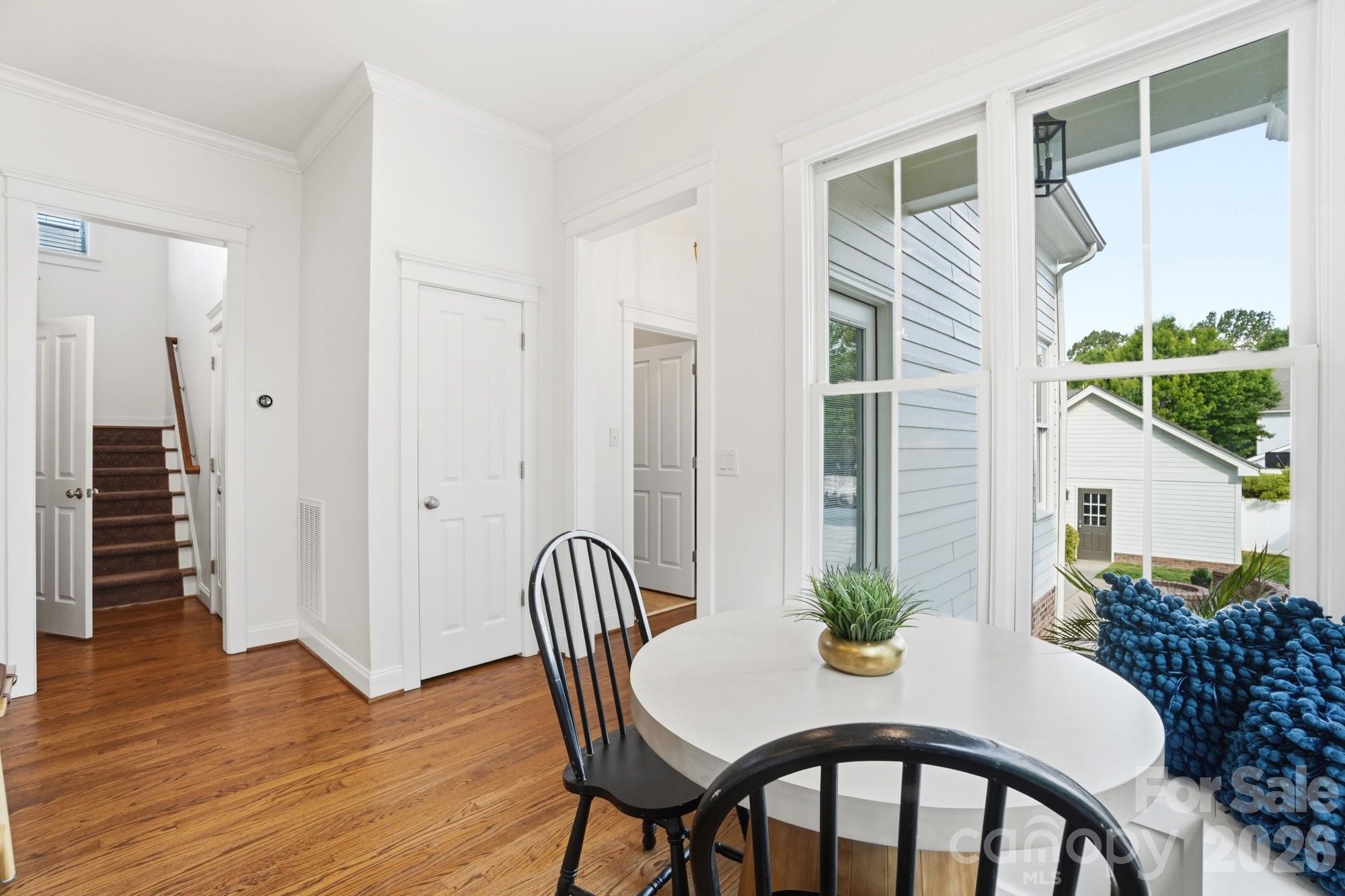 4333 Birkshire Heights Fort Mill, SC 29708 - Photo 18 of 48 a view of a dining room with furniture and wooden floor