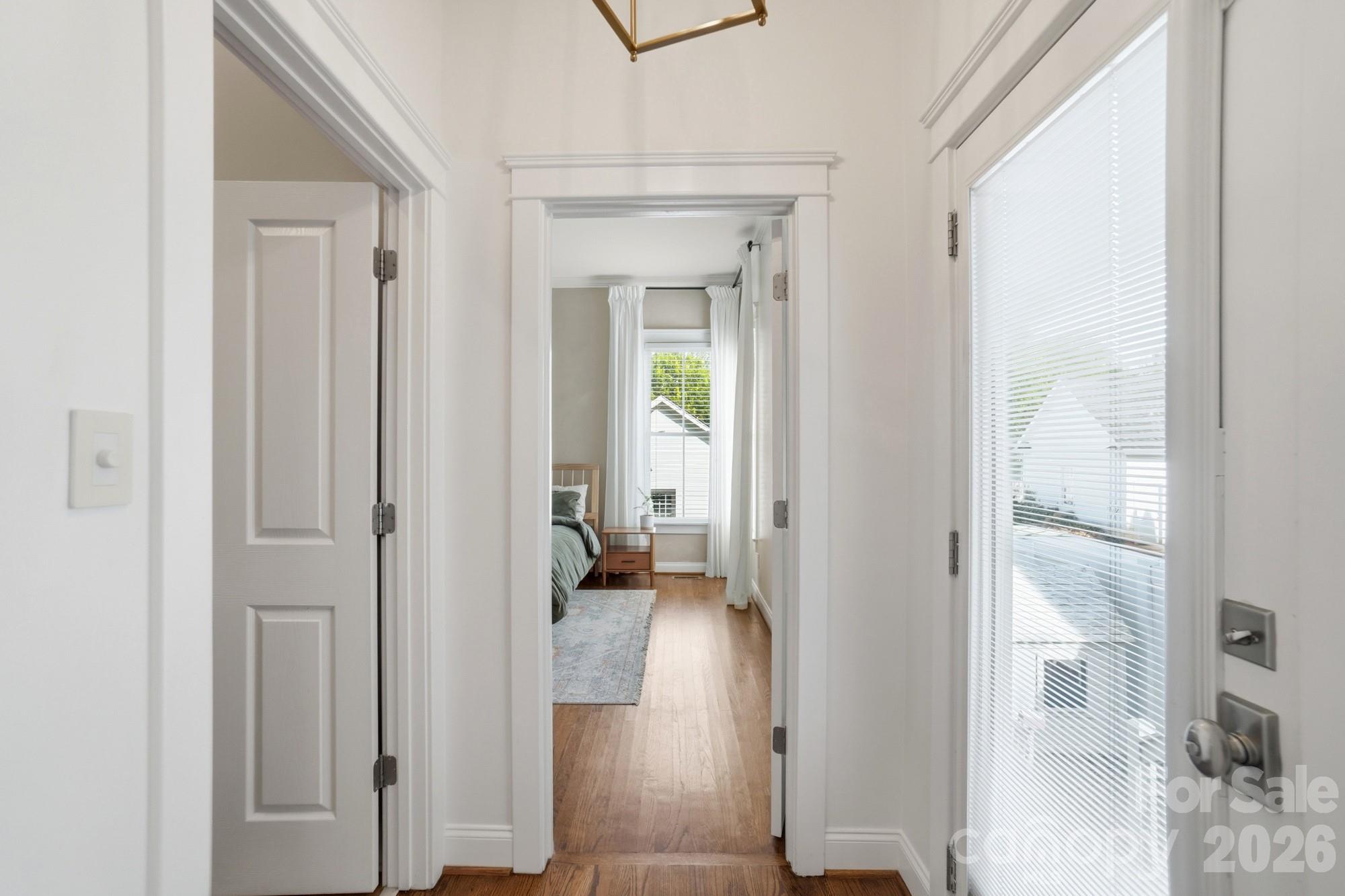 4333 Birkshire Heights Fort Mill, SC 29708 - Photo 19 of 48 a view of a hallway with wooden floor windows and a livingroom